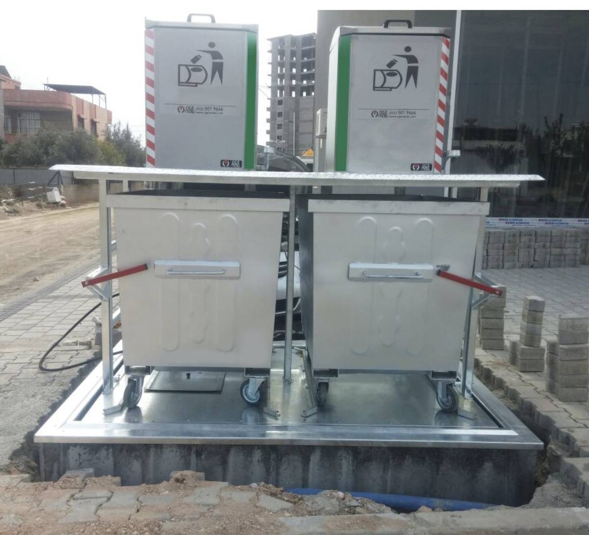GenX underground dustbin hydraulic lifting system with containers raised to surface