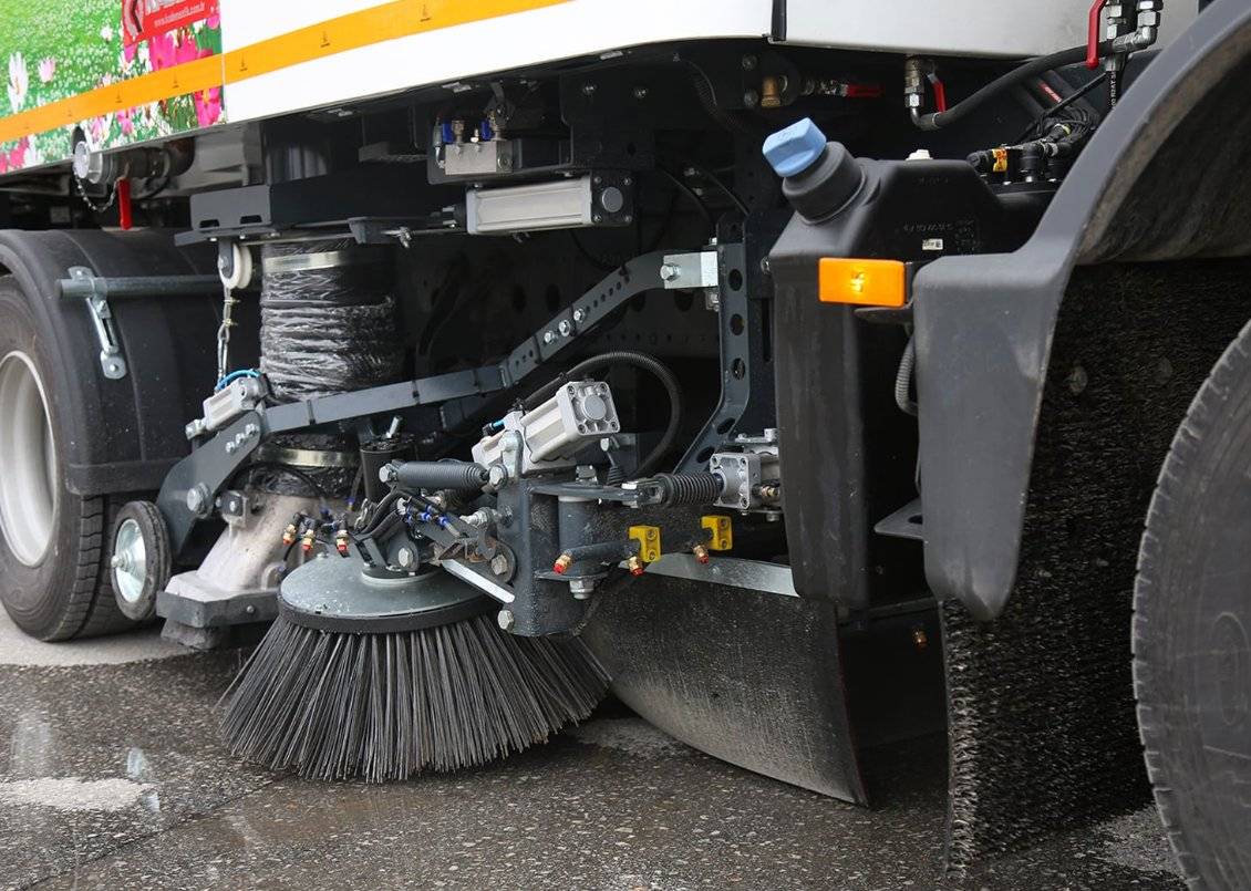 Truck mounted sweeper brush system